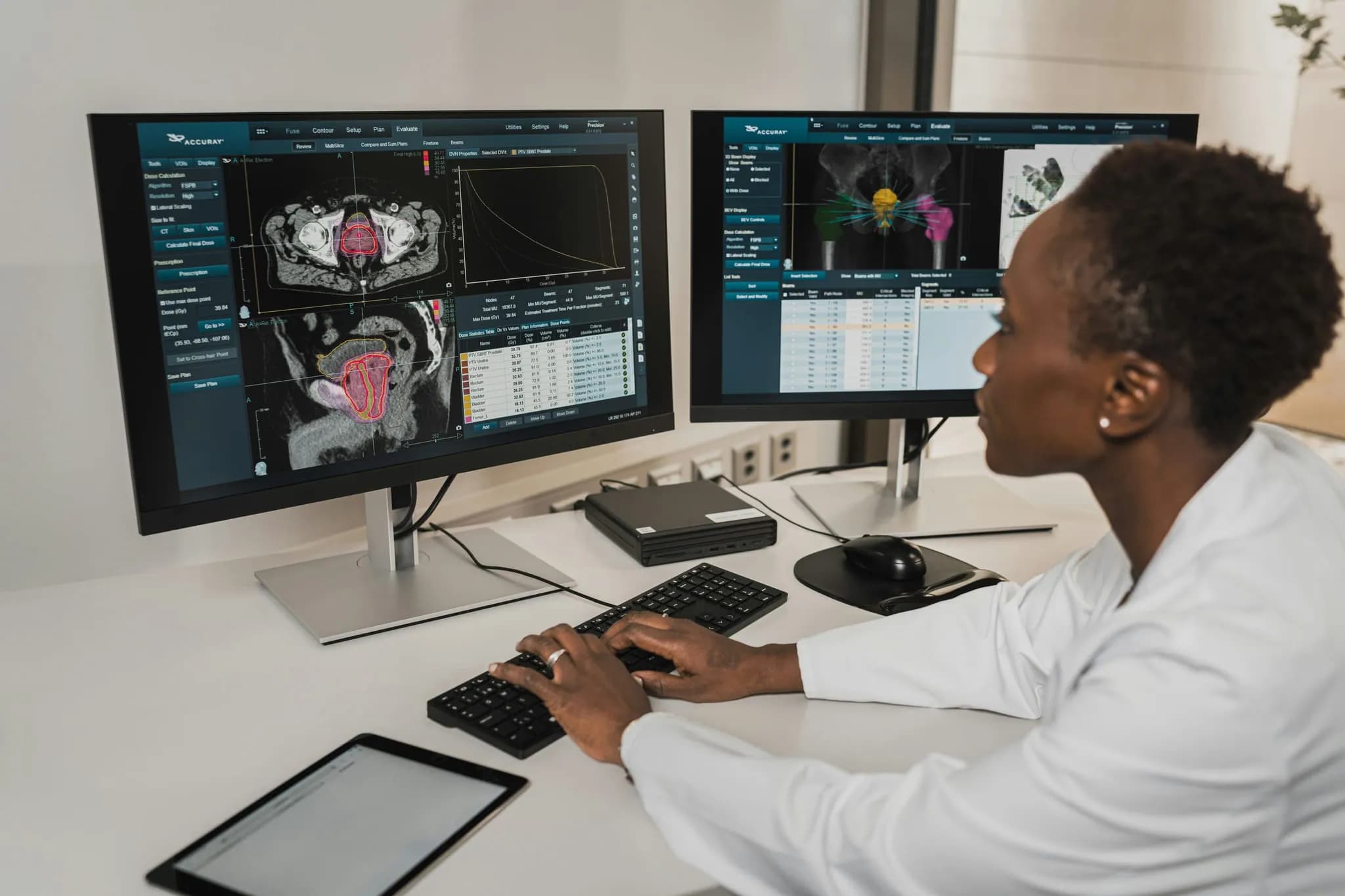 Board-certified radiologist reviewing diagnostic imaging scans at clinical workstation