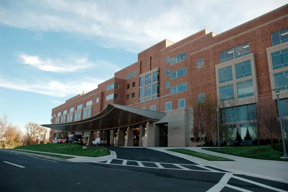 Hospital building exterior with a covered main entrance
