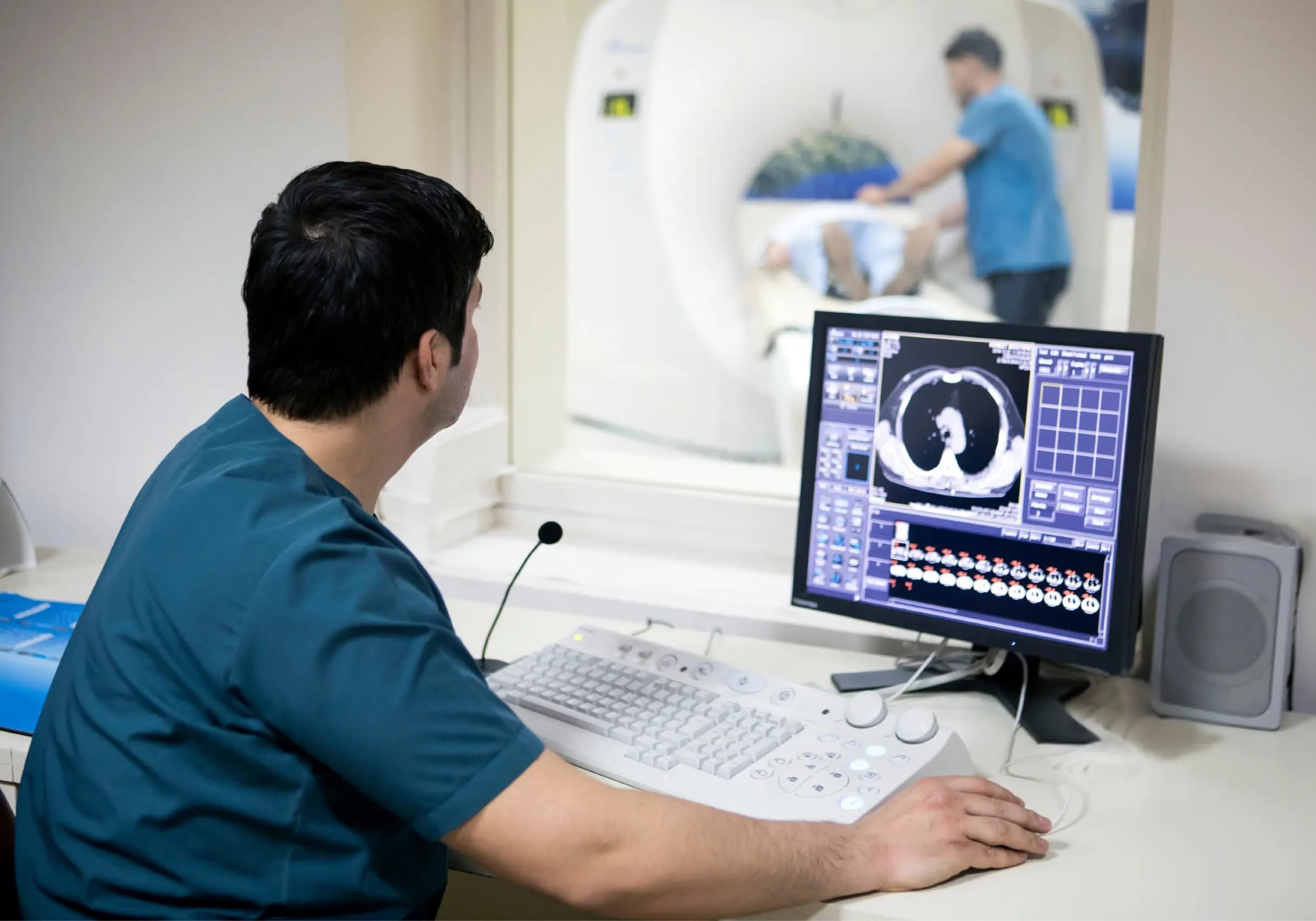 Clinical and IT teams reviewing medical imaging workflows on diagnostic screens