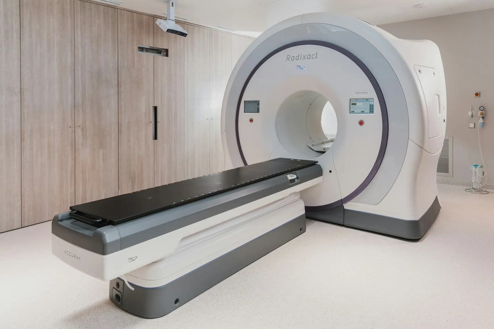 Modern outpatient imaging suite with a large-bore scanner and patient table